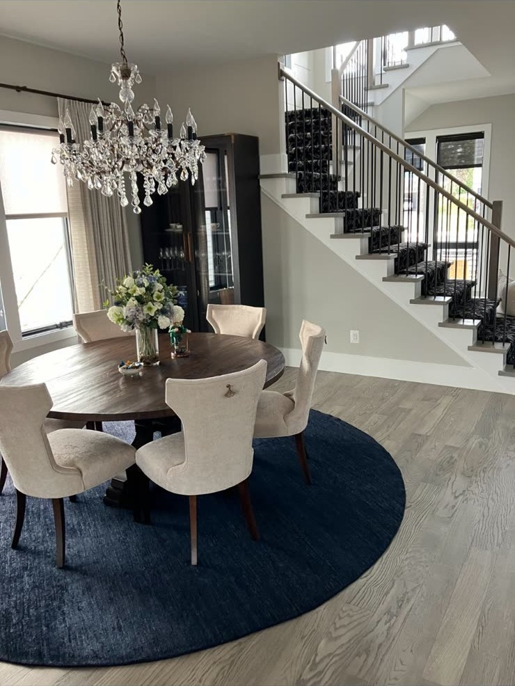 Dining room with crystal chandelier over a round table
