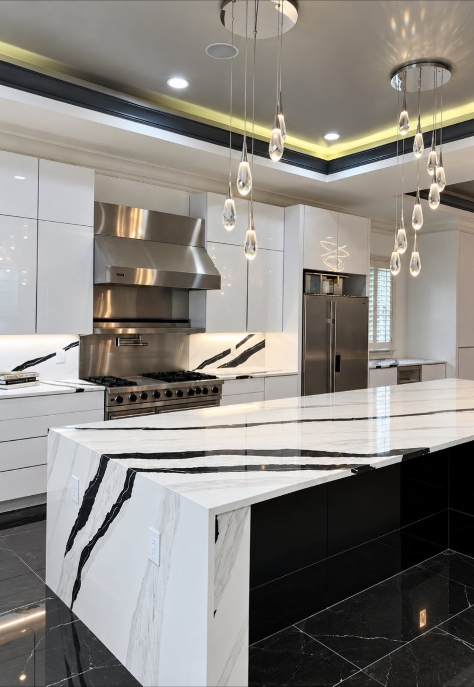 Luxury kitchen with marble waterfall island and sculptural pendant lighting