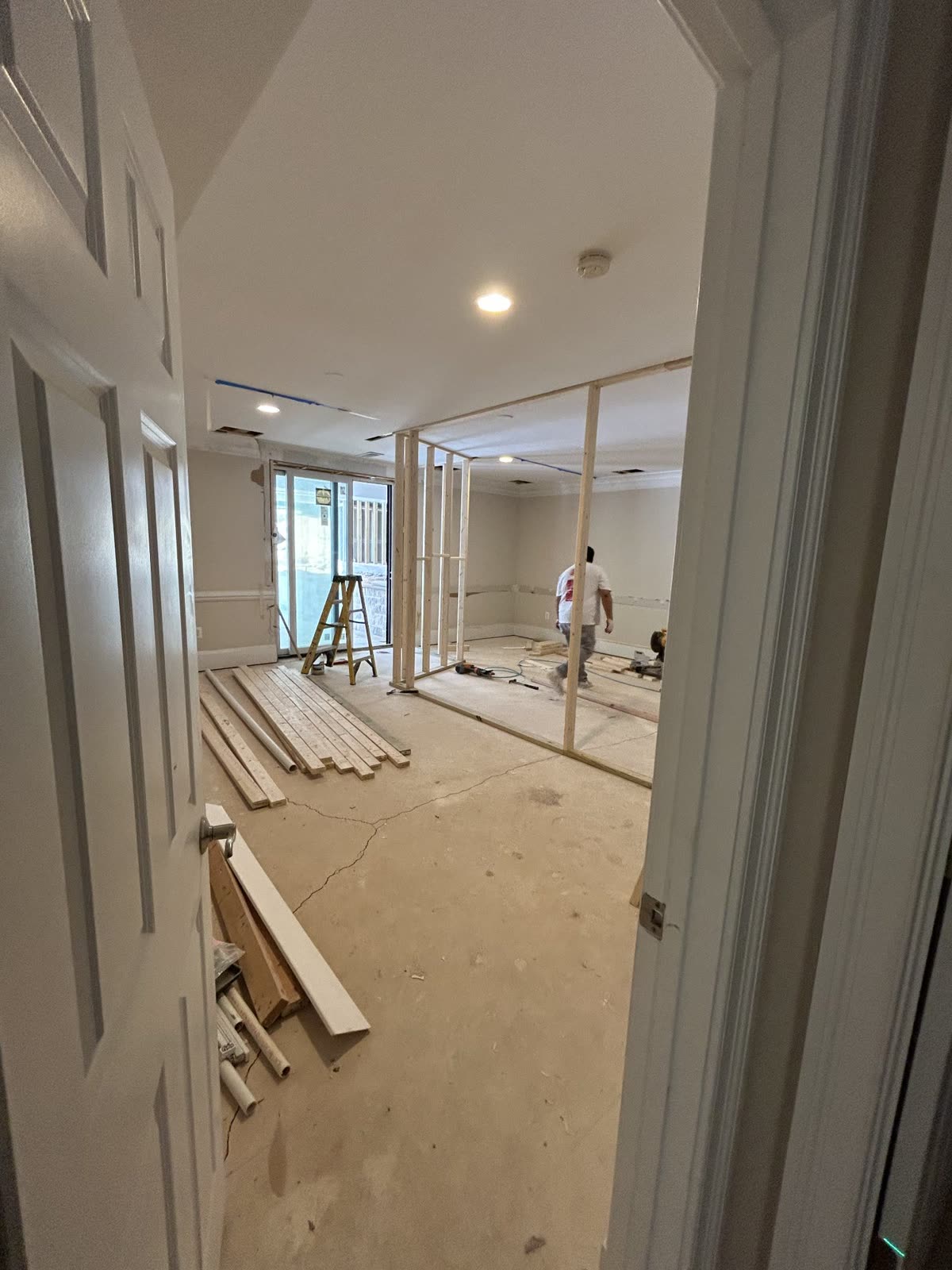 New wall framing going up in a room under construction