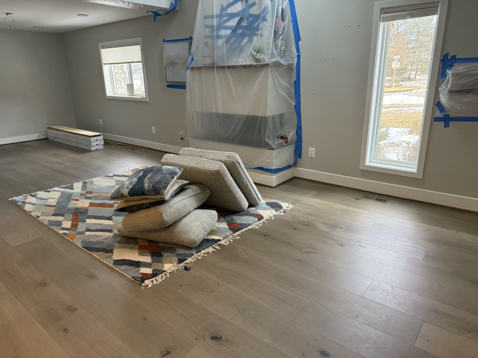 Flooring installation in progress in a living room